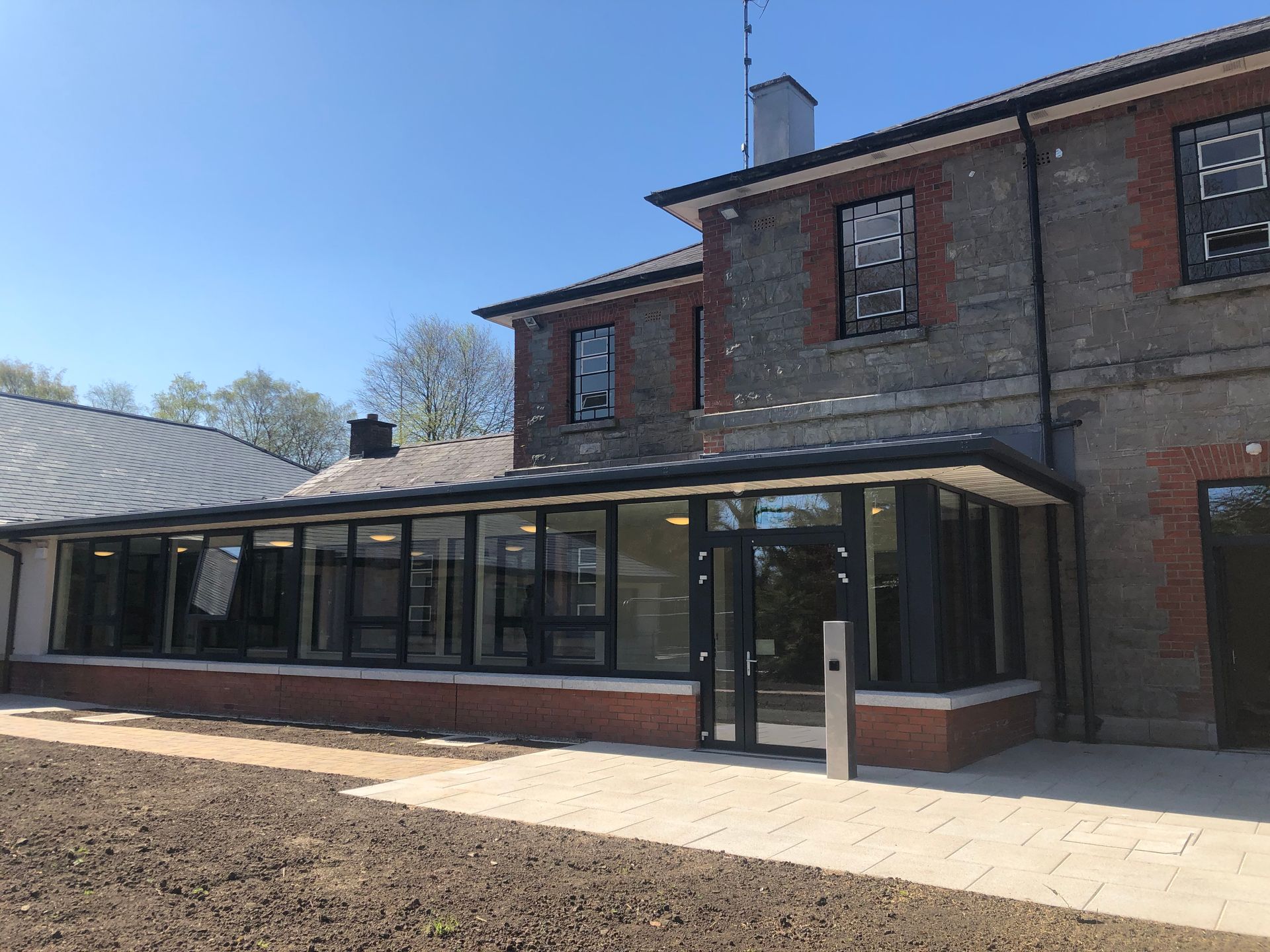 A large brick building with a lot of windows and doors.