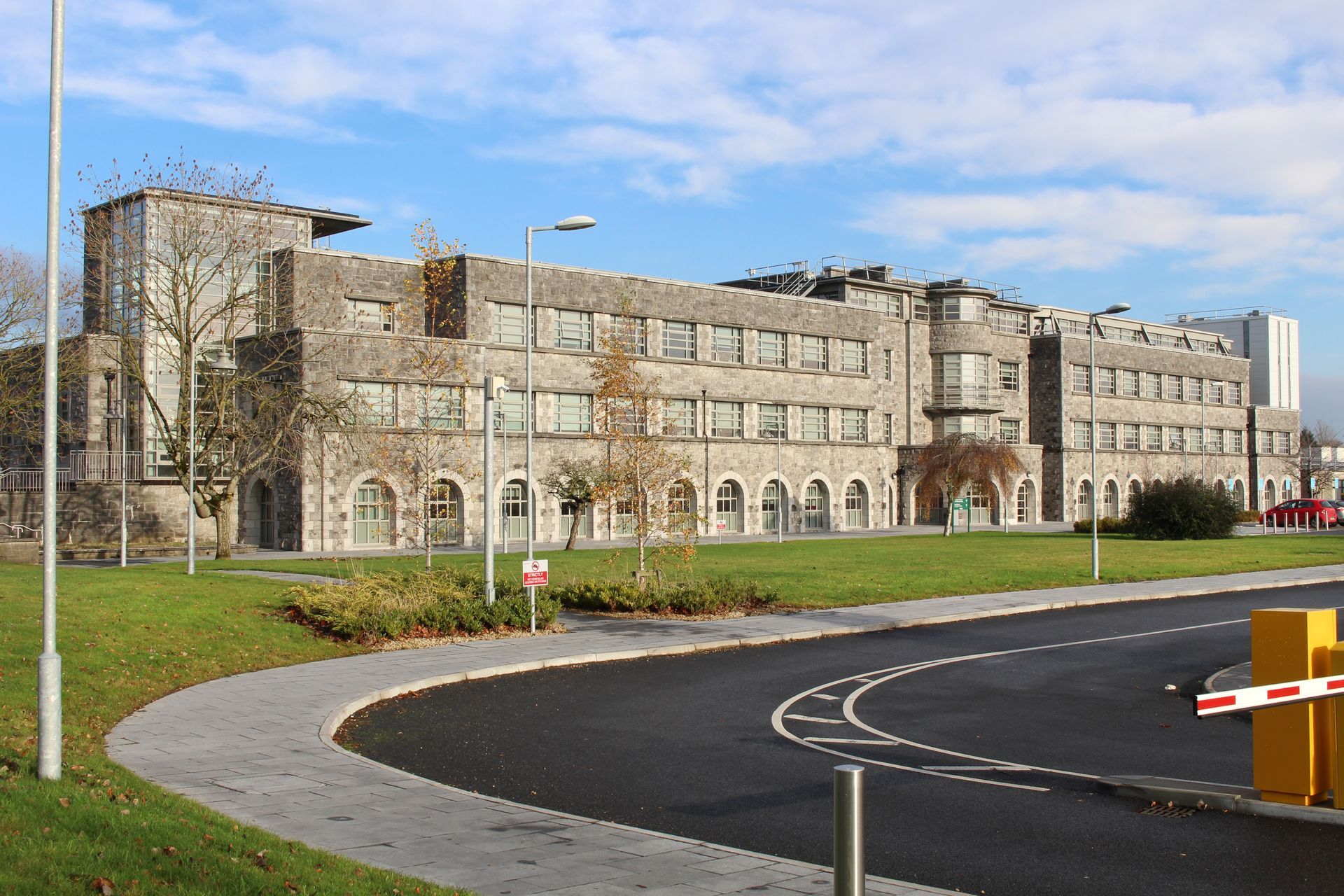 A large building with a parking meter in front of it