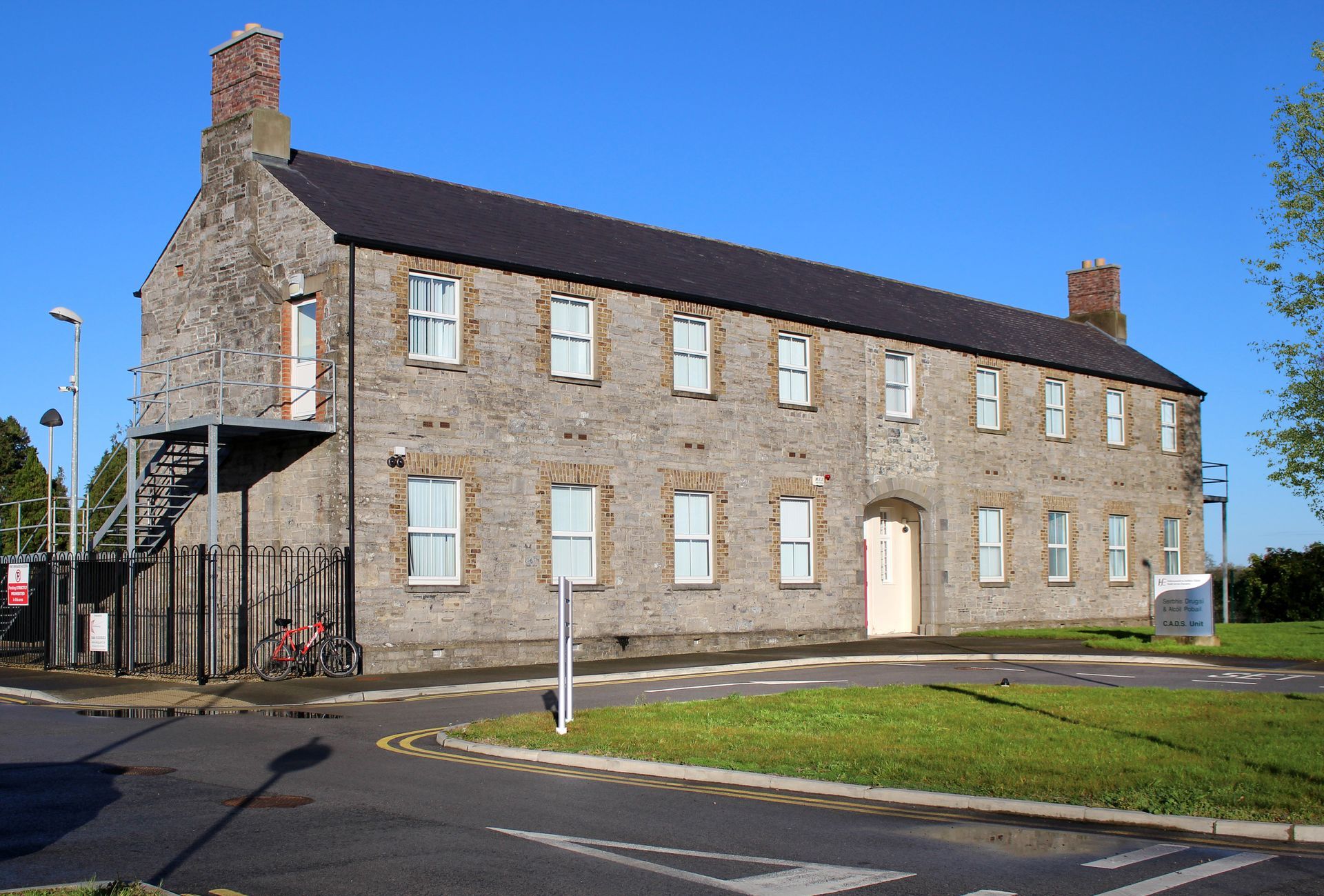 A large stone building with stairs leading up to it