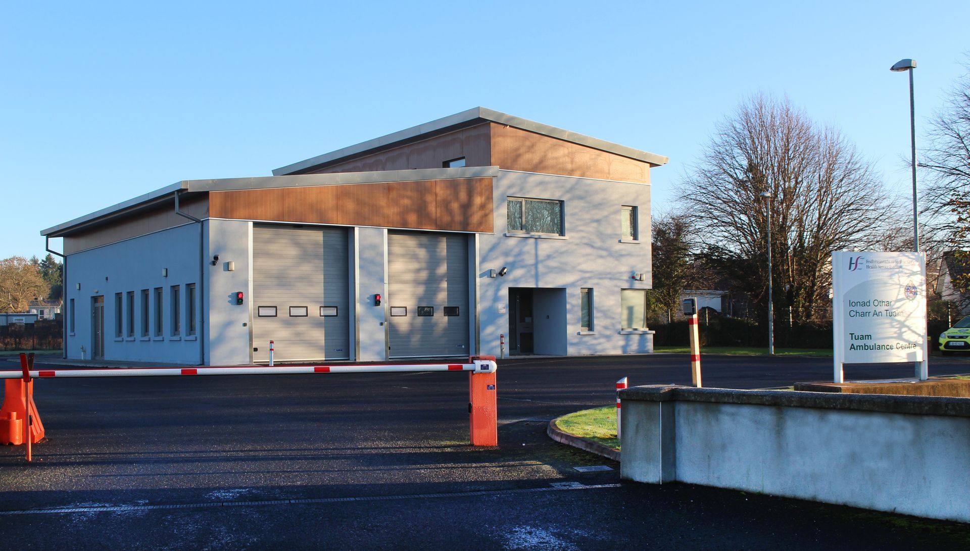 A building with a red and white barrier in front of it