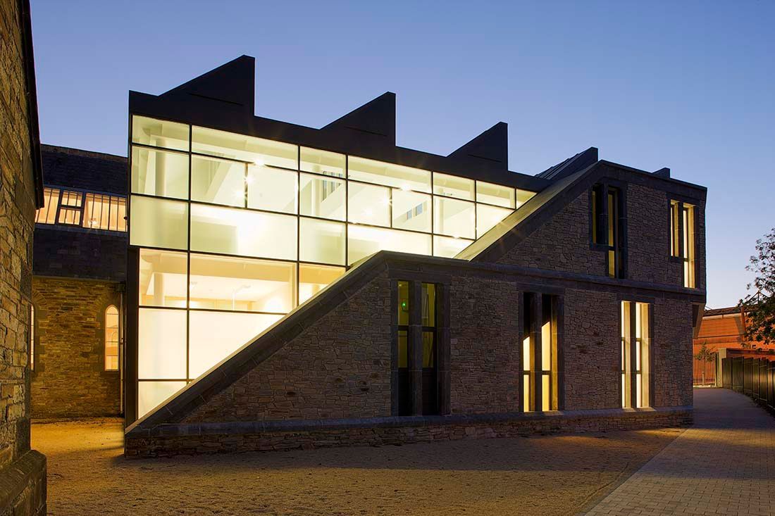 A building with a lot of windows and stairs leading up to it