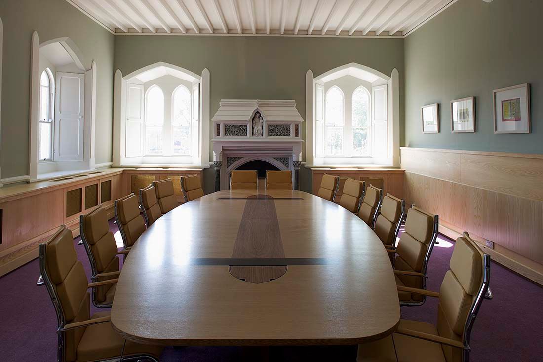 A conference room with a long table and chairs