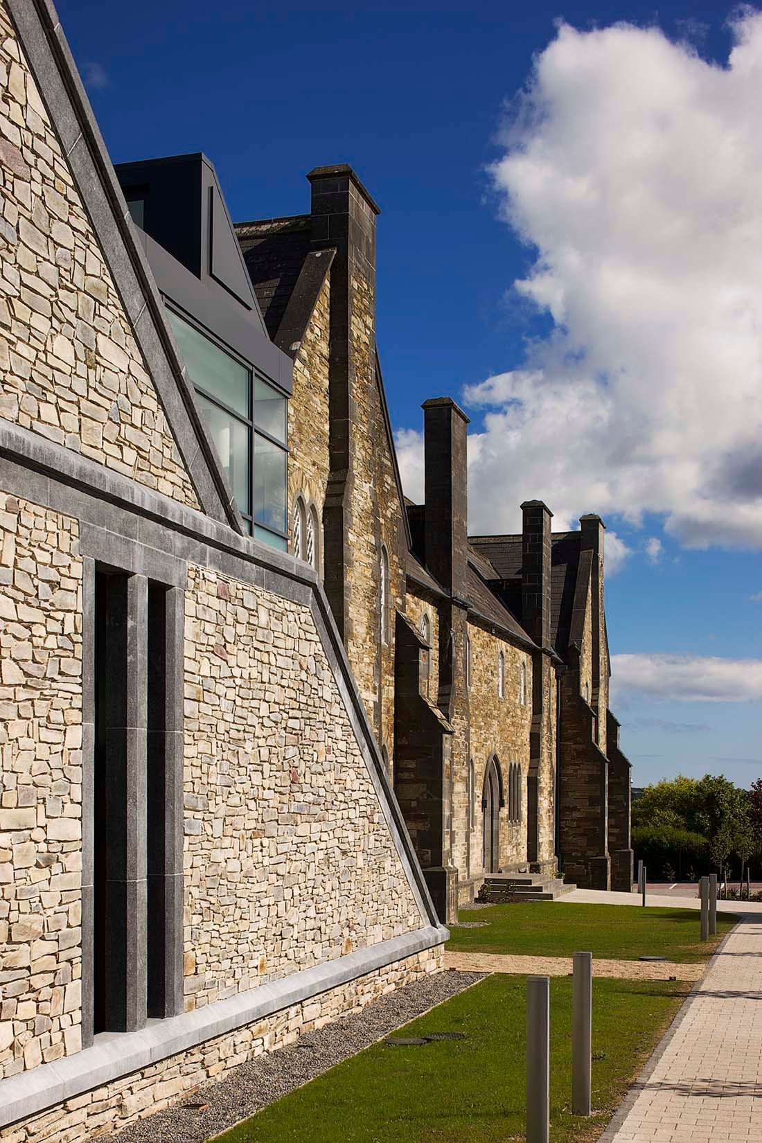 A stone building with a blue sky in the background