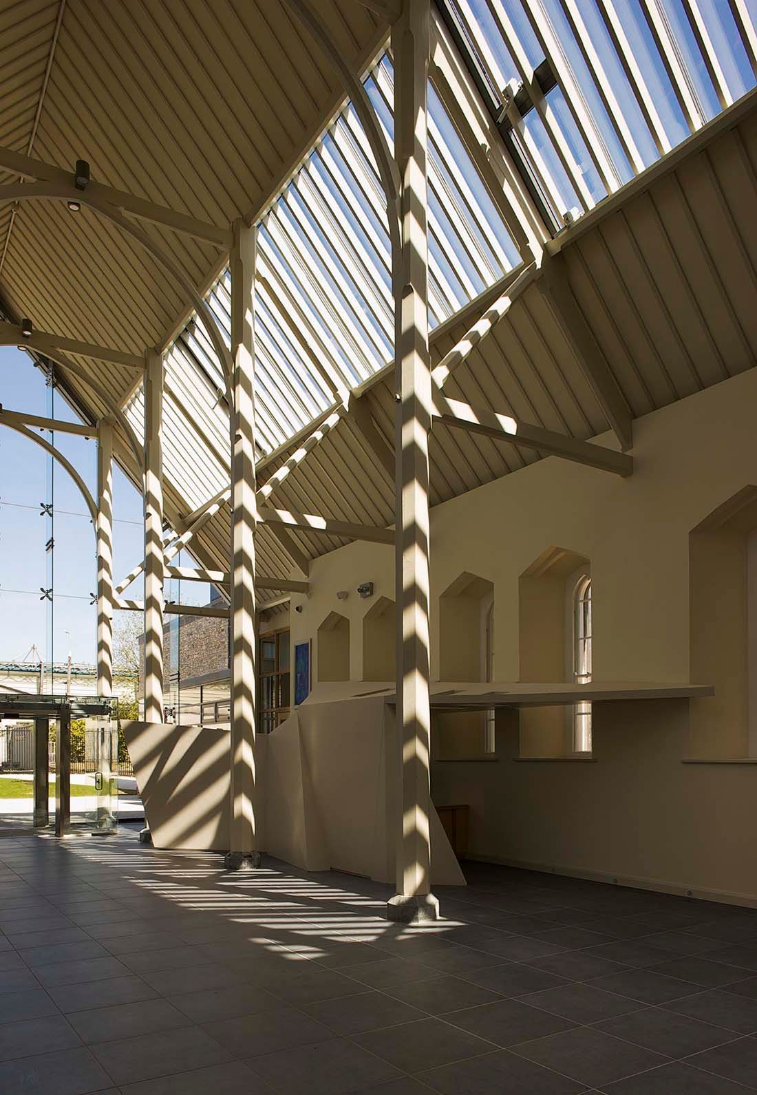 A building with a roof that has a lot of windows