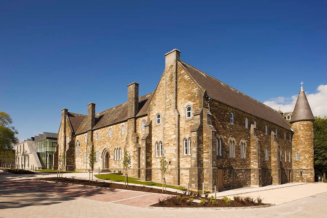 A large stone building with a tower on top of it.