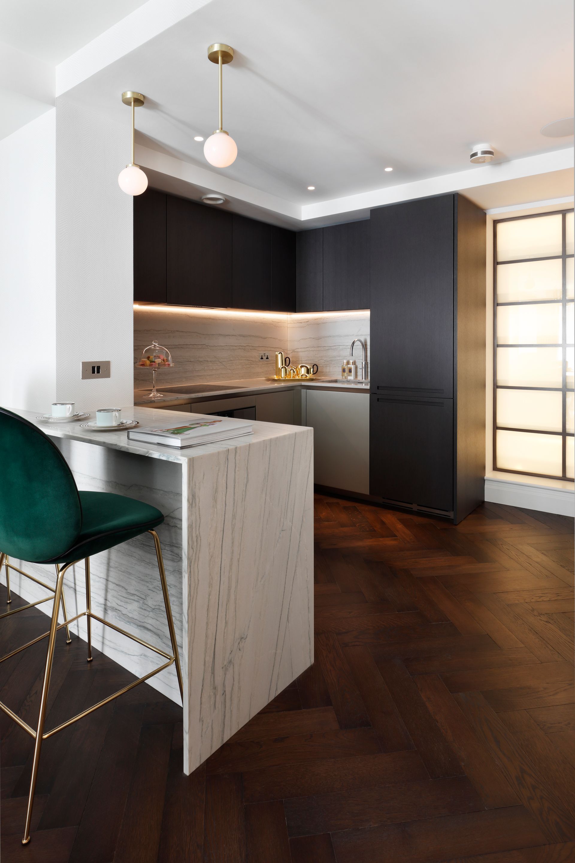 A kitchen with a table and chairs in it