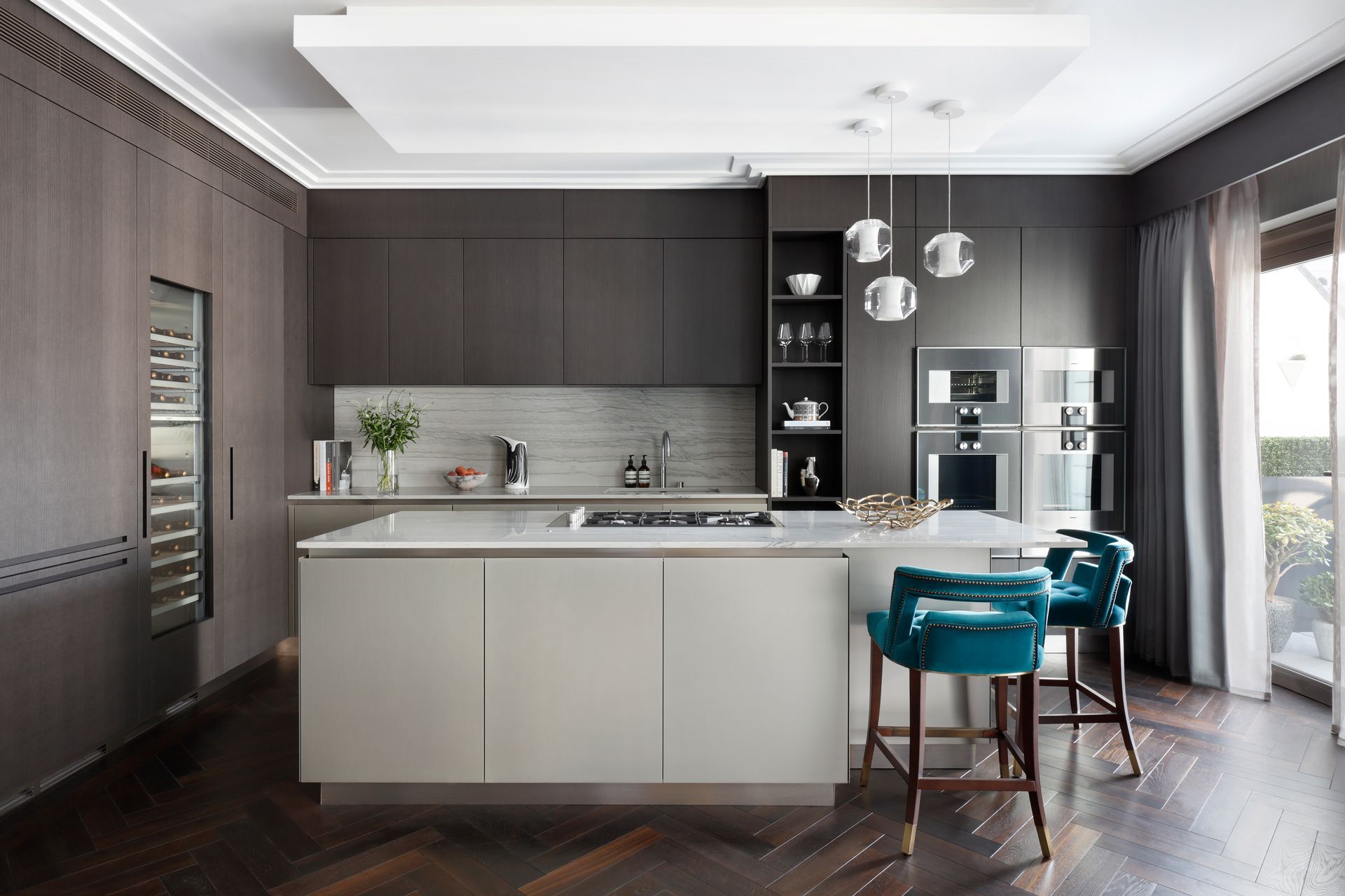 A kitchen with a large island in the middle of the room.