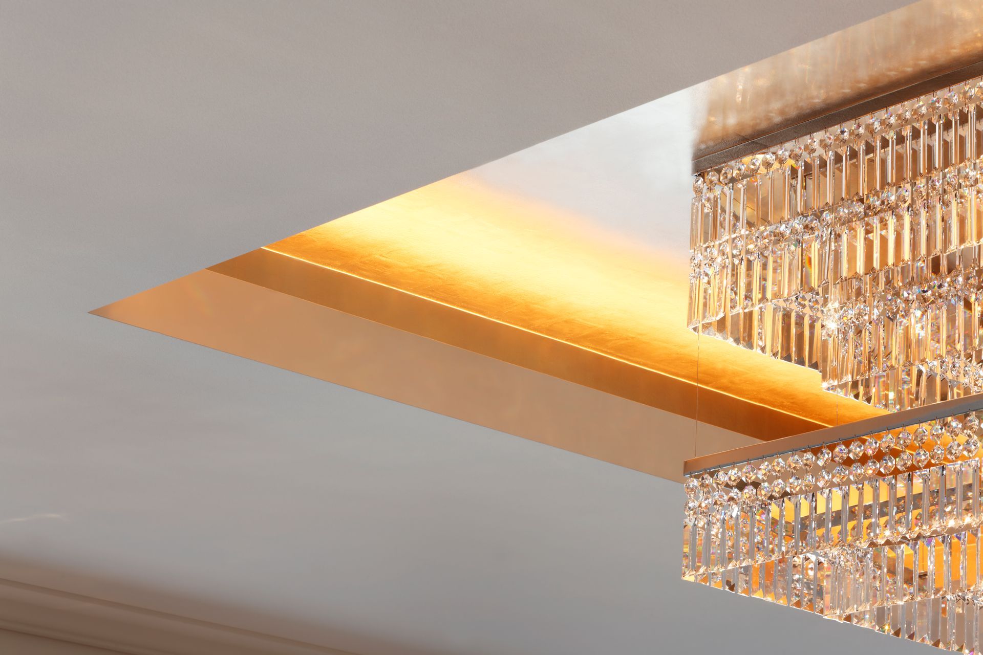 A chandelier is hanging from the ceiling in a room.