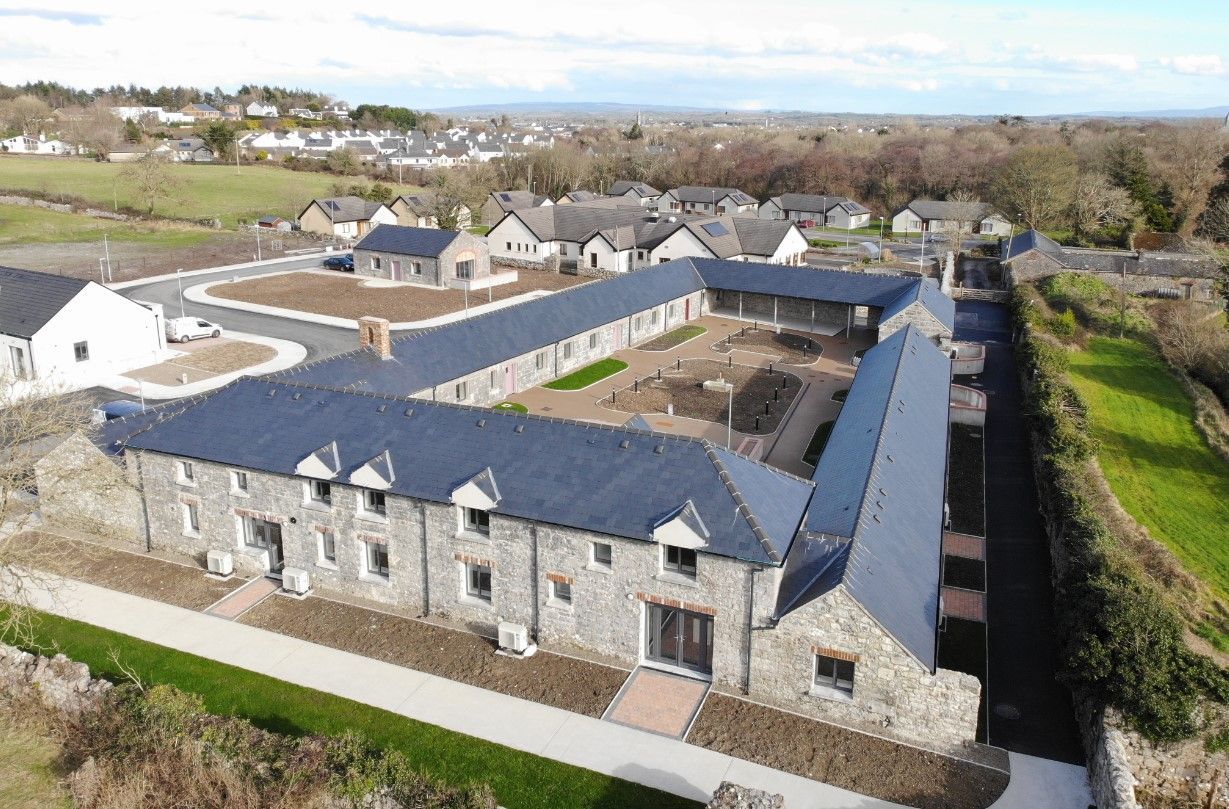 An aerial view of a row of houses with slate roofs