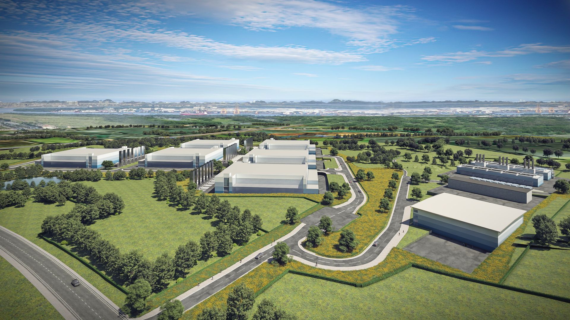 An aerial view of a large industrial area with lots of buildings and trees.