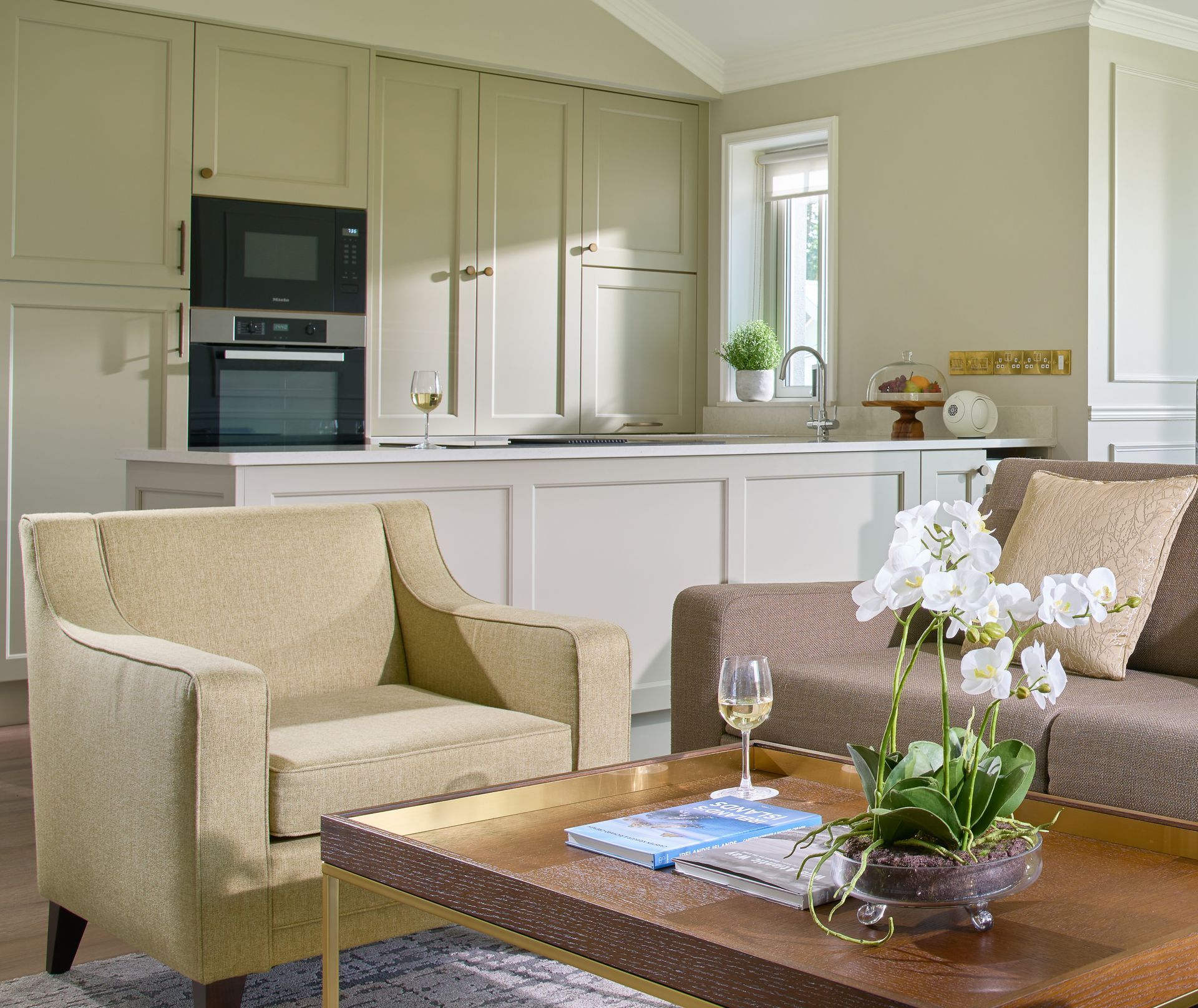 A living room with a couch a chair and a coffee table