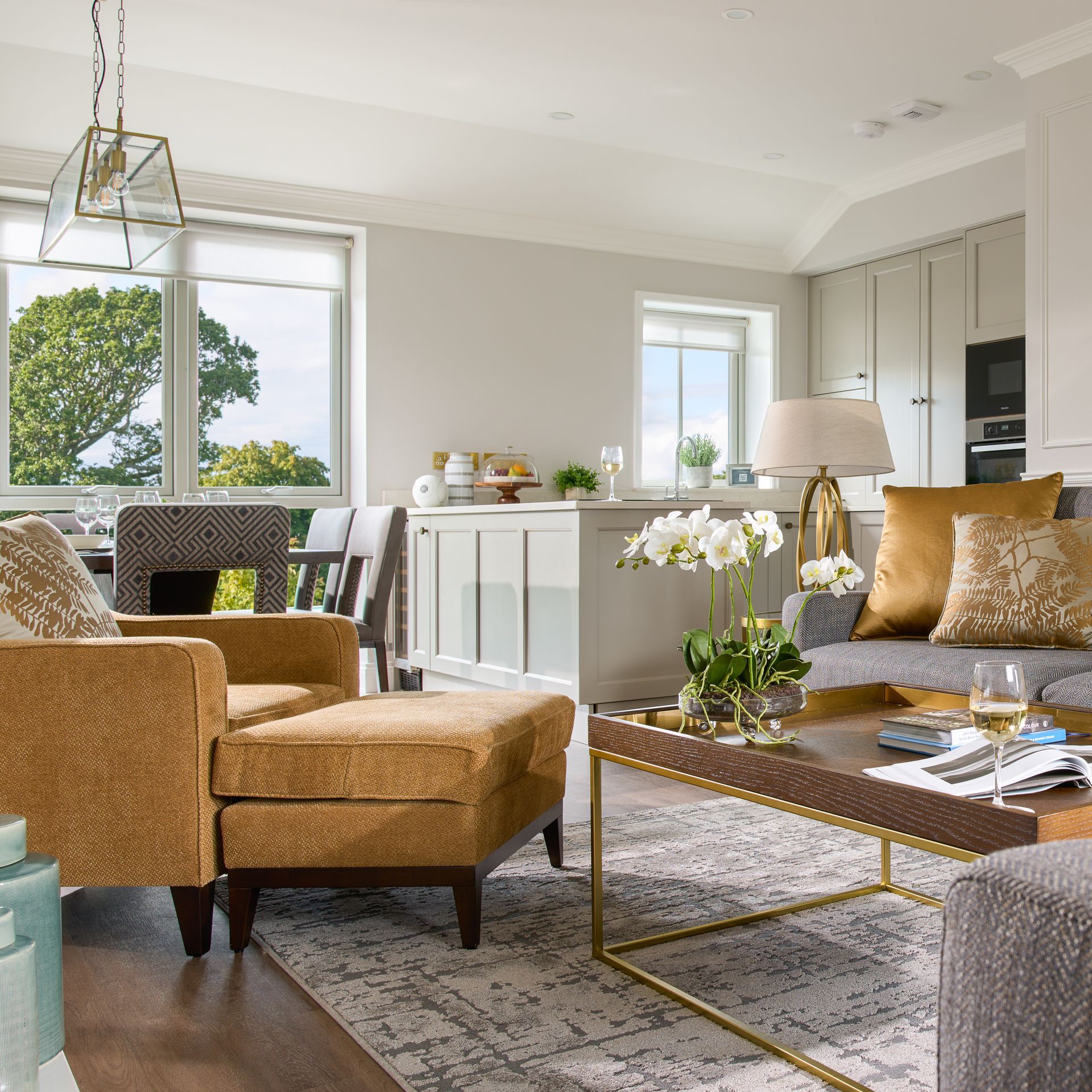A living room with a couch a chair and a coffee table