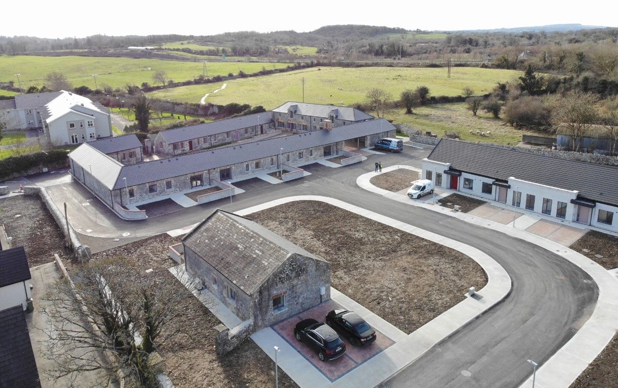 An aerial view of a row of houses in a residential area.