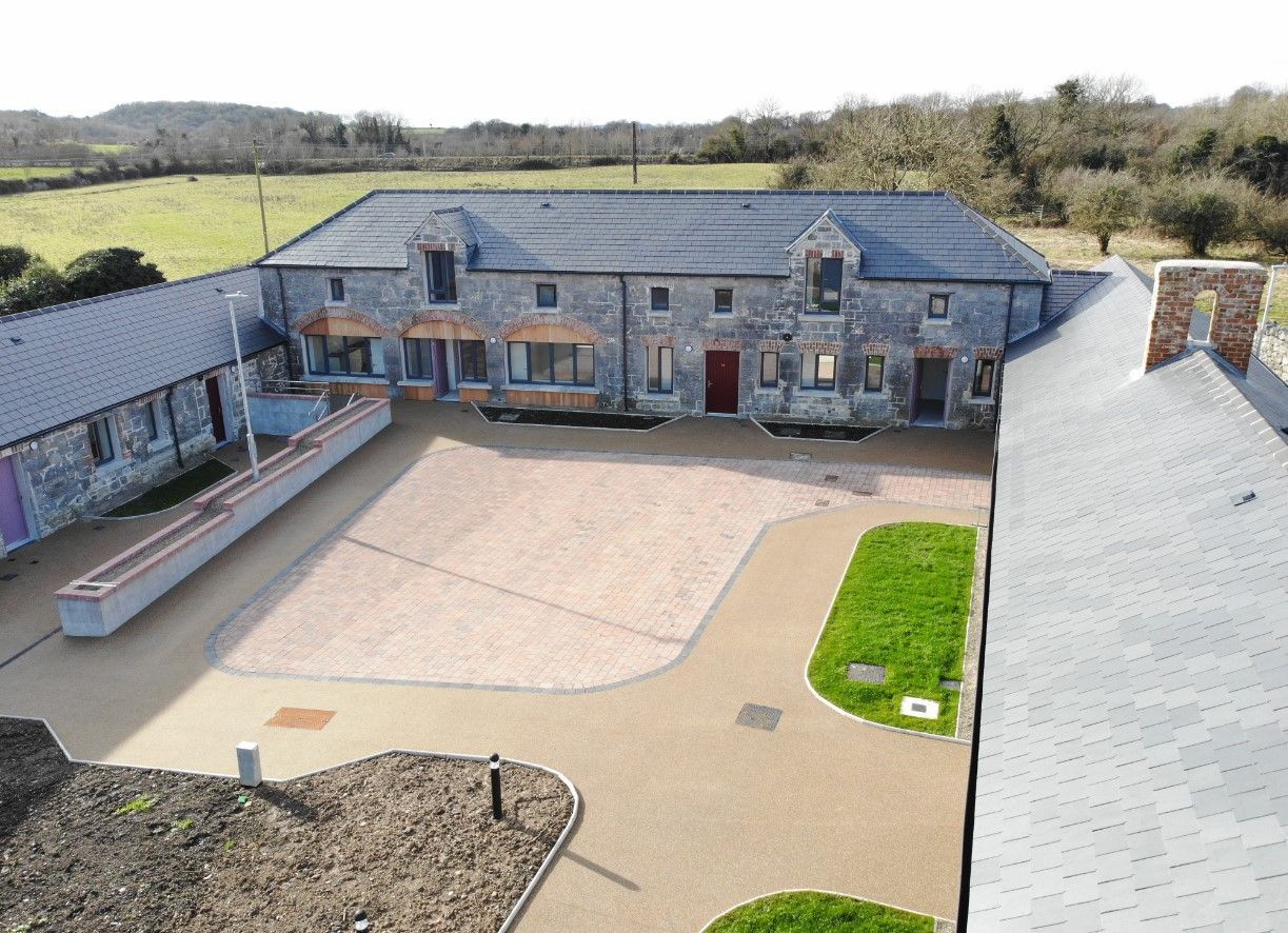 An aerial view of a large house with a lot of windows