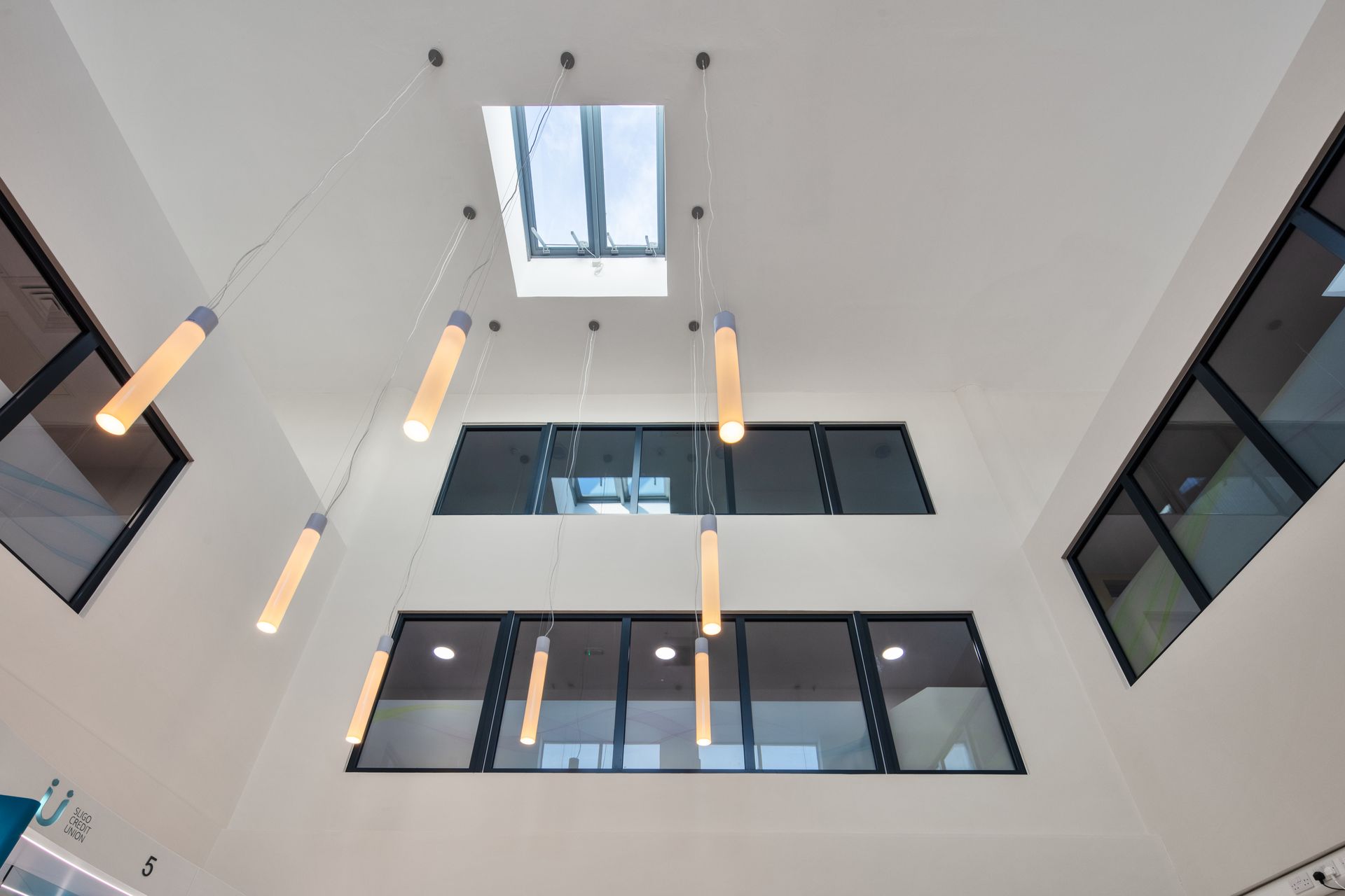 Looking up at the ceiling of a building with a skylight