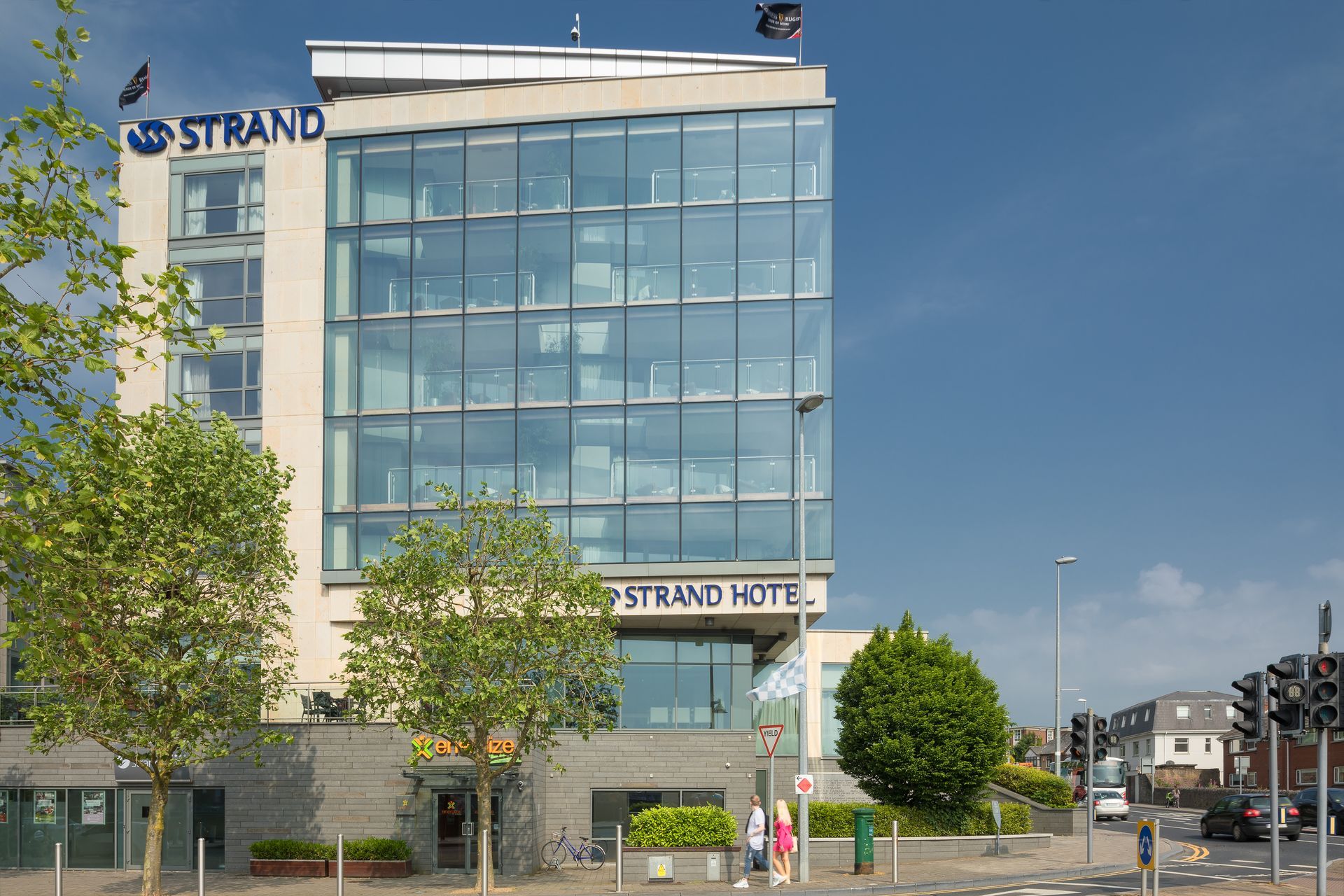 A large building with the word strand on it