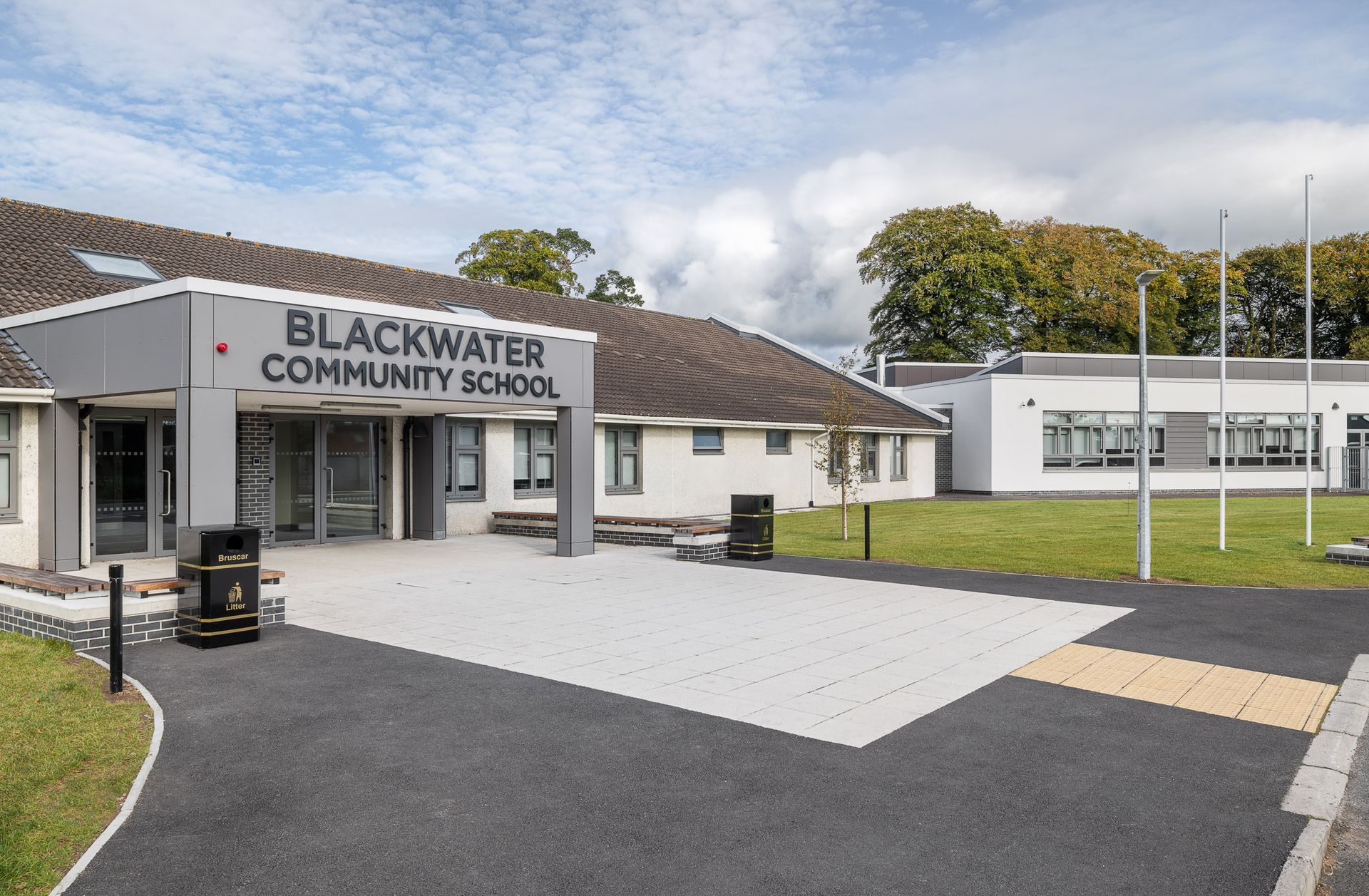 A large building with a sign that says blackwater community school