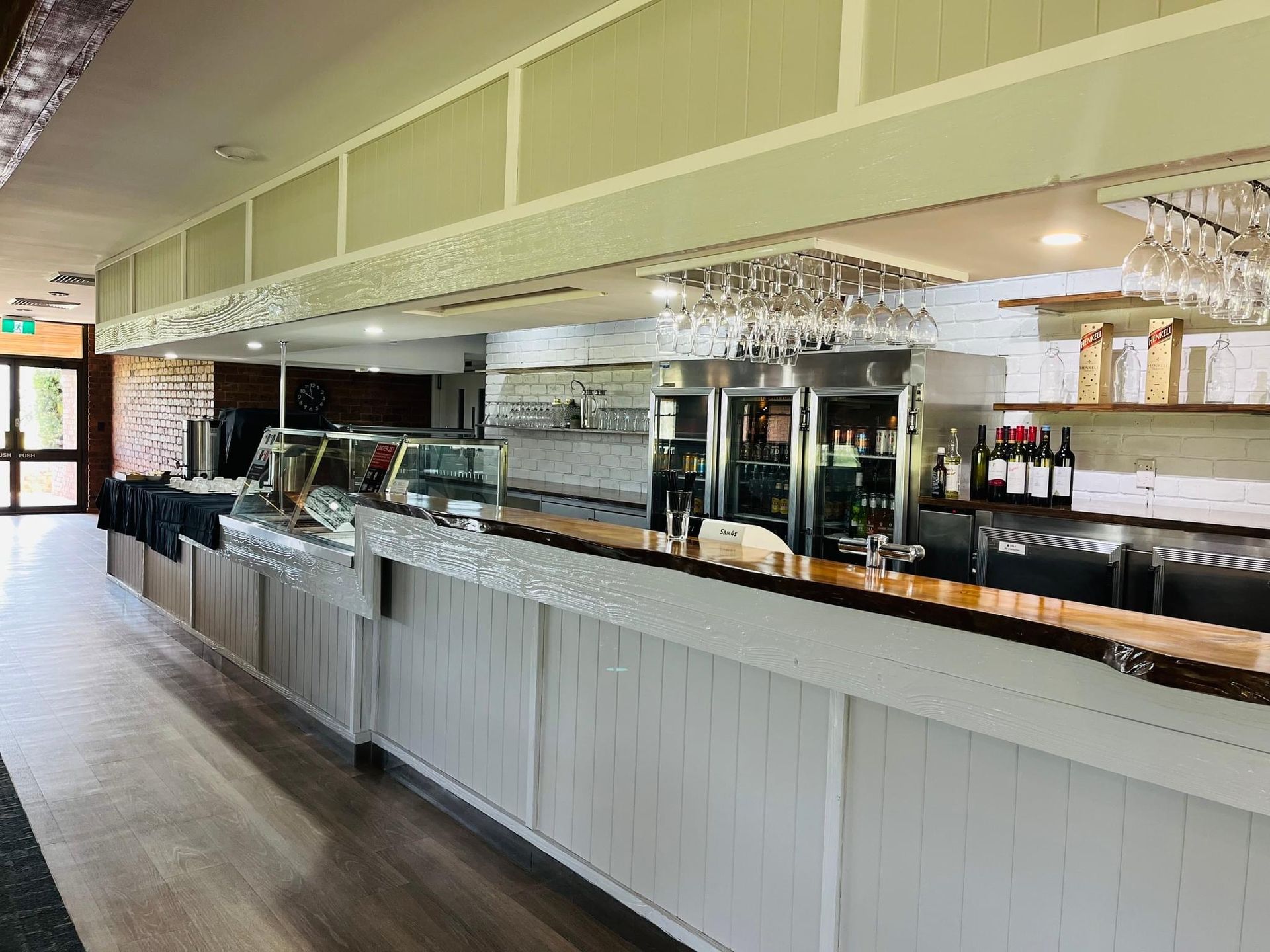 A Long Bar in a Restaurant with a lot of Wine Glasses on it - Function Venue in Hillvue, NSW