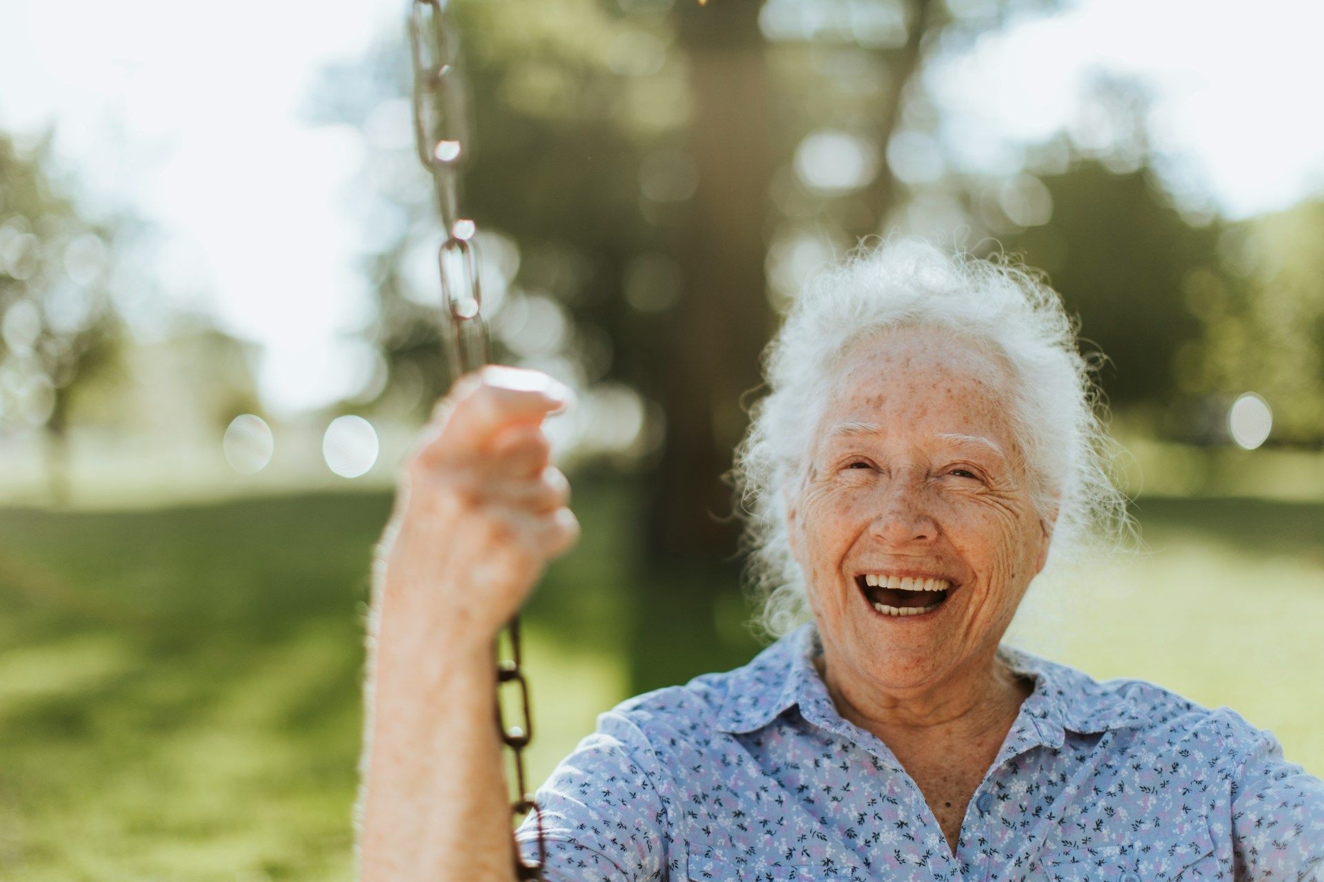 A man is standing next to a woman and a man in an empty room.