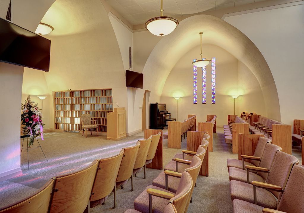 A church with rows of chairs and a podium