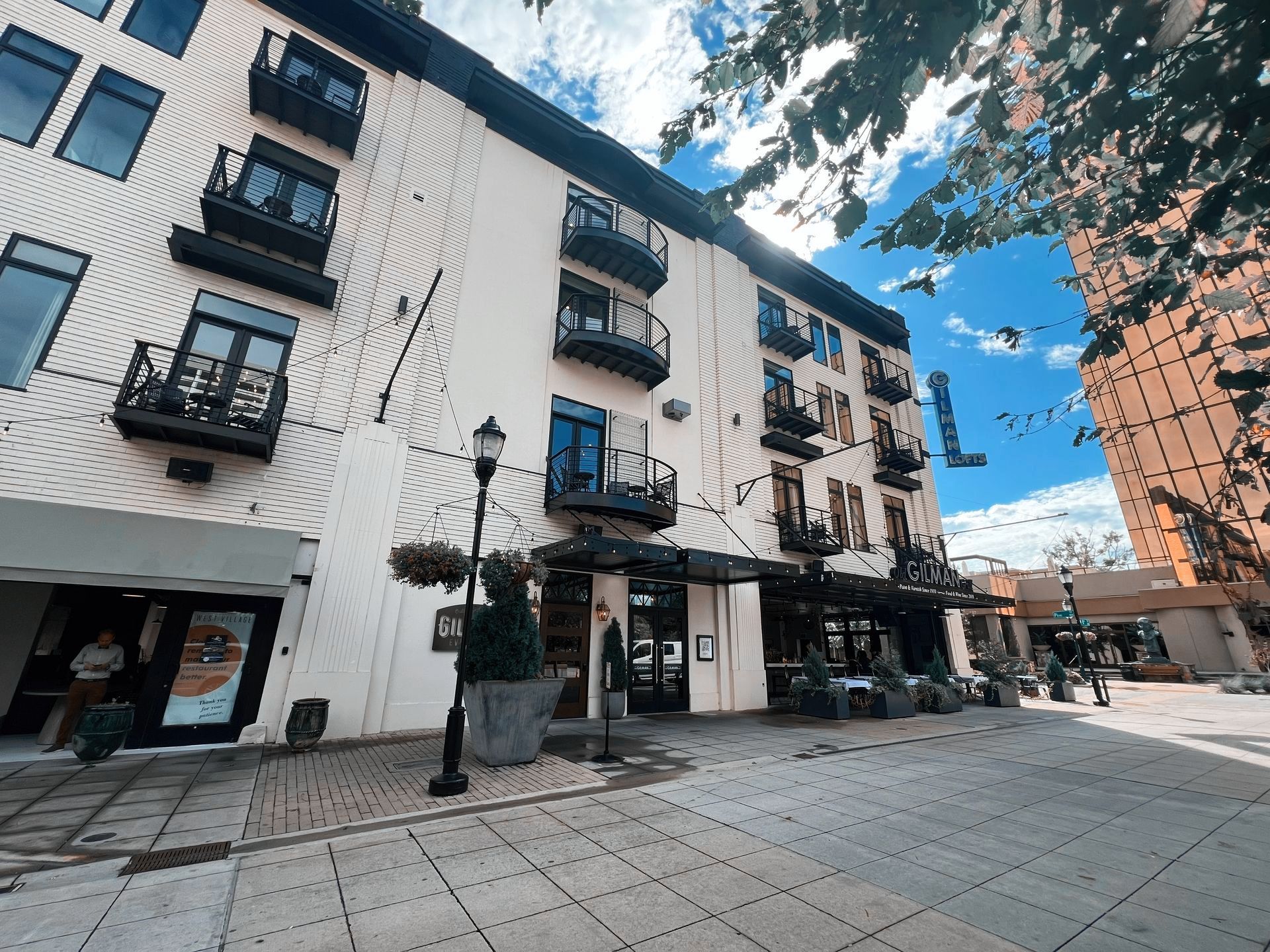 A large white building with a lot of windows and balconies.