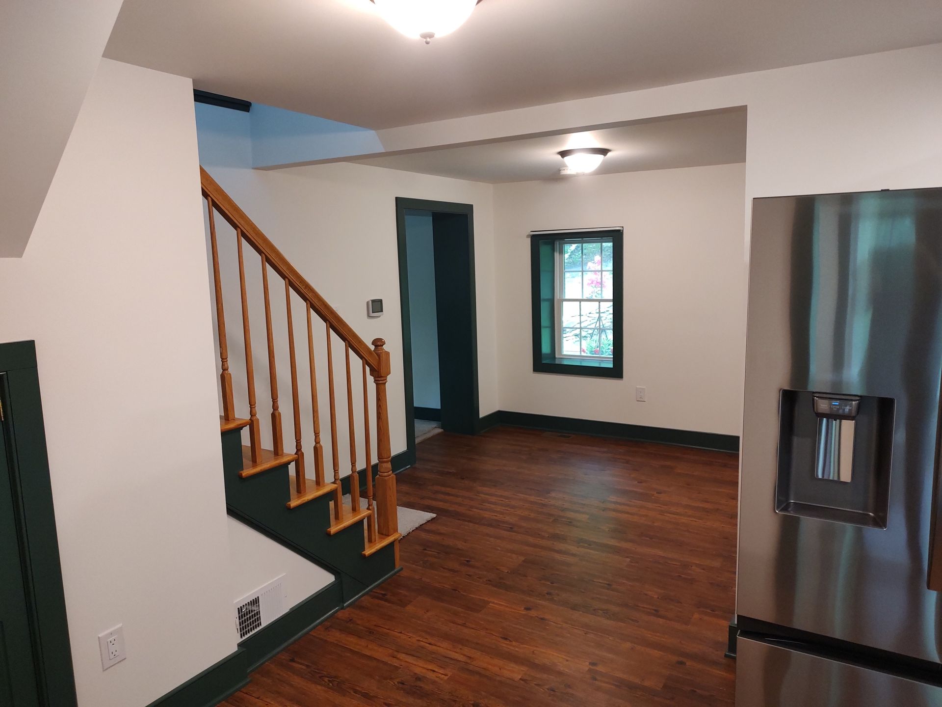 Entryway with stairs showing hardwood floor, Floors by Recon