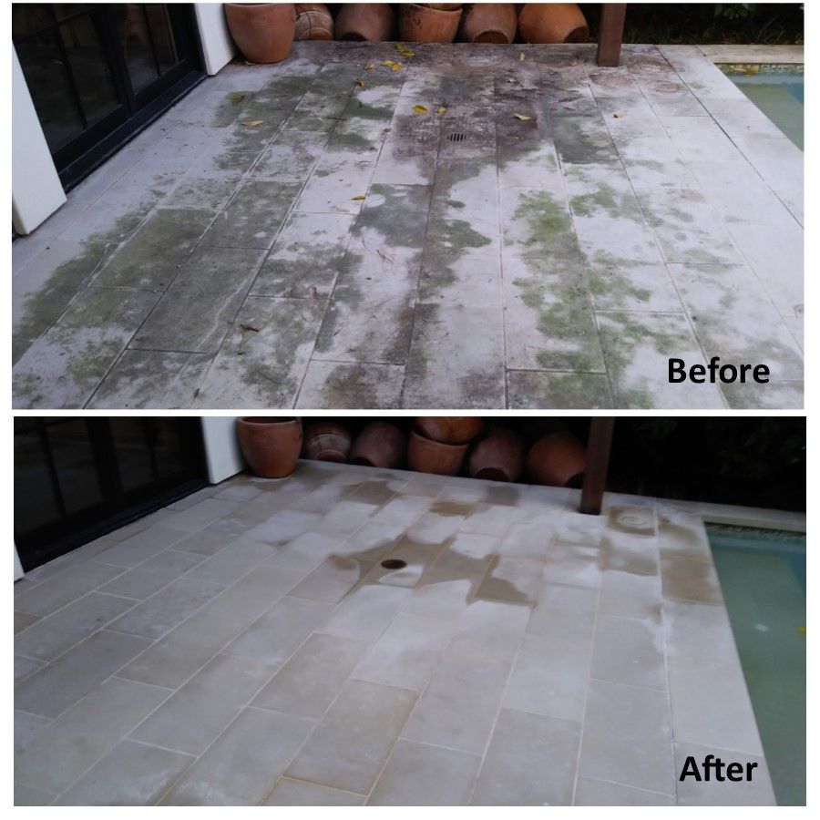 Patio floor before and after cleaning, revealing light stone tiles.
