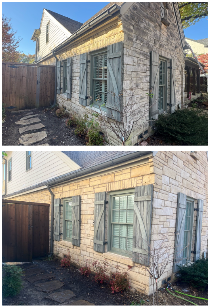 Stone house with weathered gray shutters and green windows.