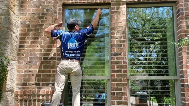 a man cleaning a window