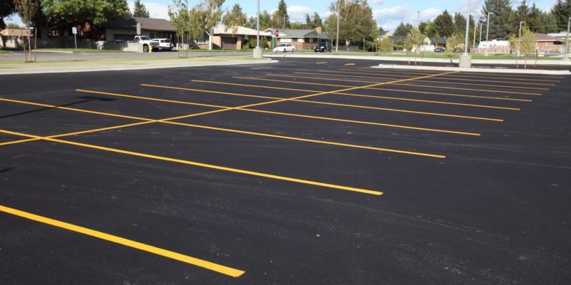 A parking lot with a lot of yellow lines on it