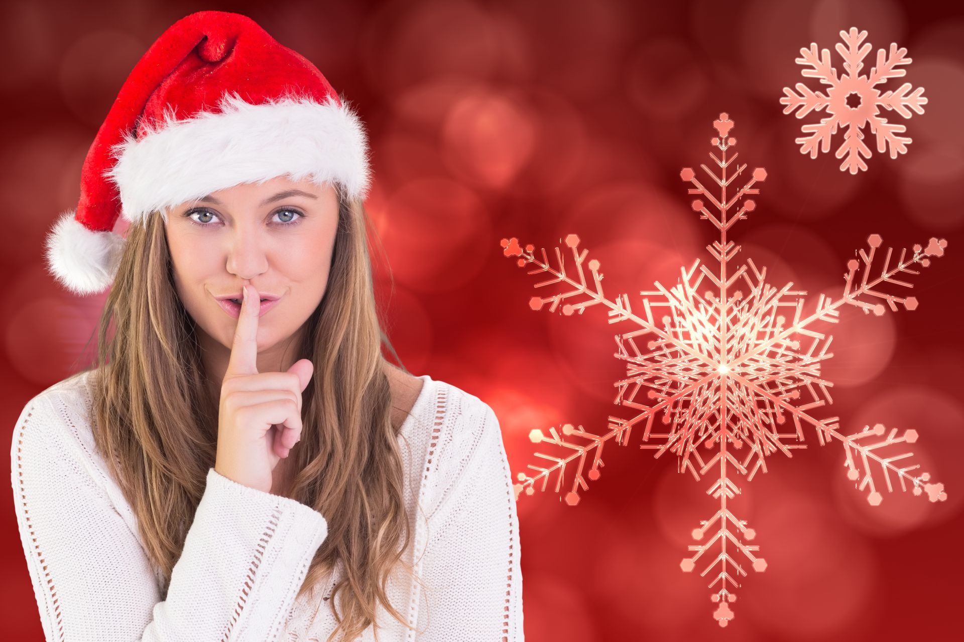 Woman in Santa hat gestures