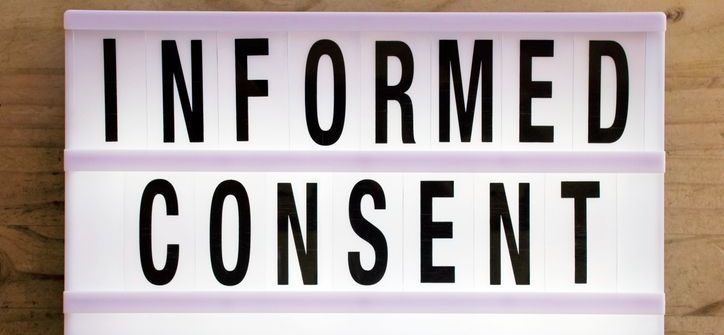 A light box with the words informed consent written on it