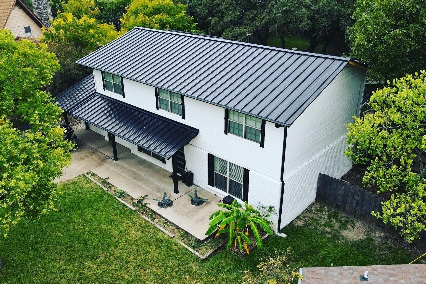 A beautiful metal roof on a home in San Marcos, Texas installed by Birdcreek Roofing