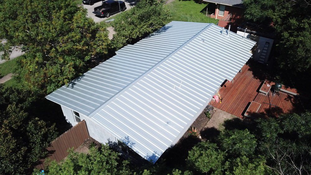 Brand new metal roof on a house in a residential neighborhood