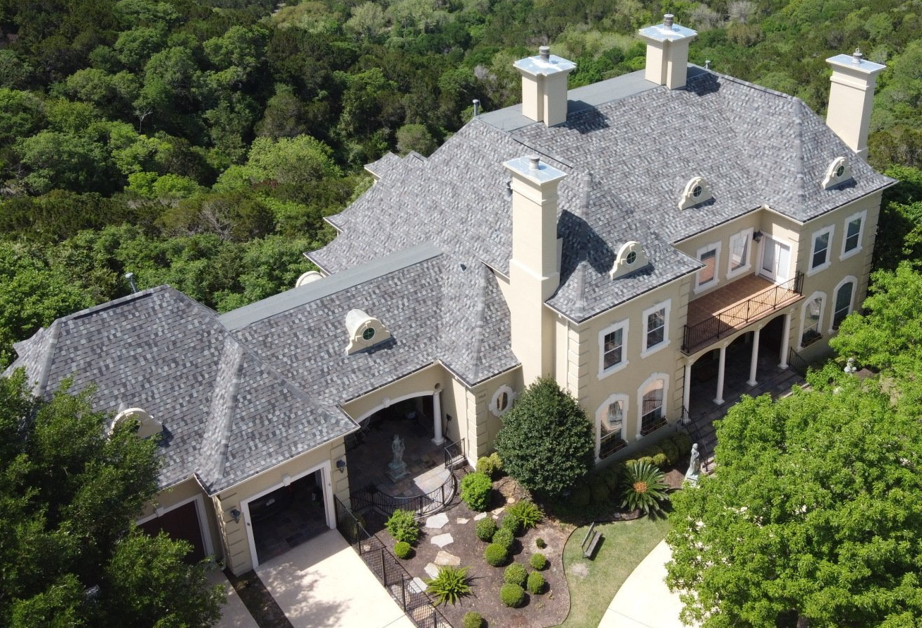 Large home with a Shingle Roof installed by Birdcreek Roofing