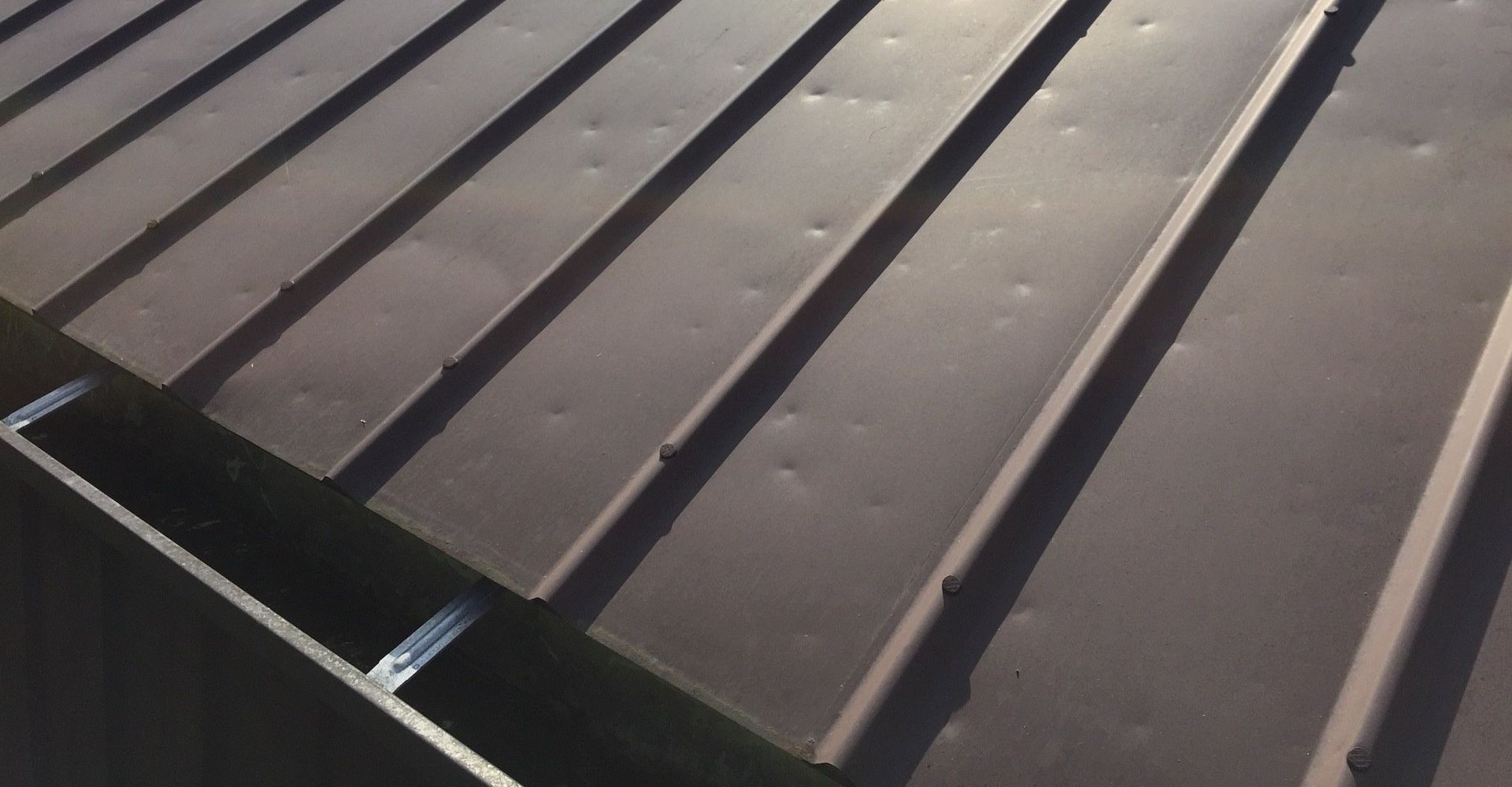 Hail damage on a metal roof