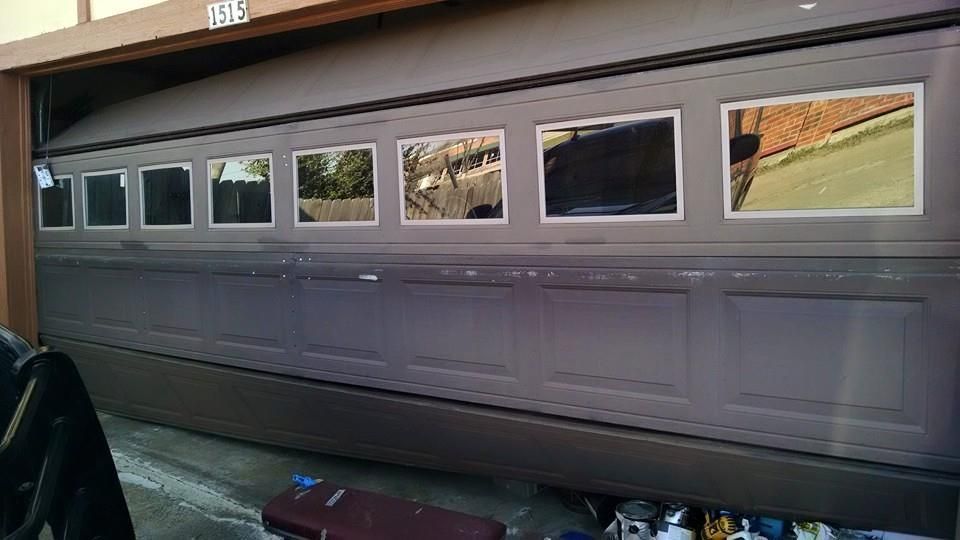 A garage door with a bunch of pictures on it