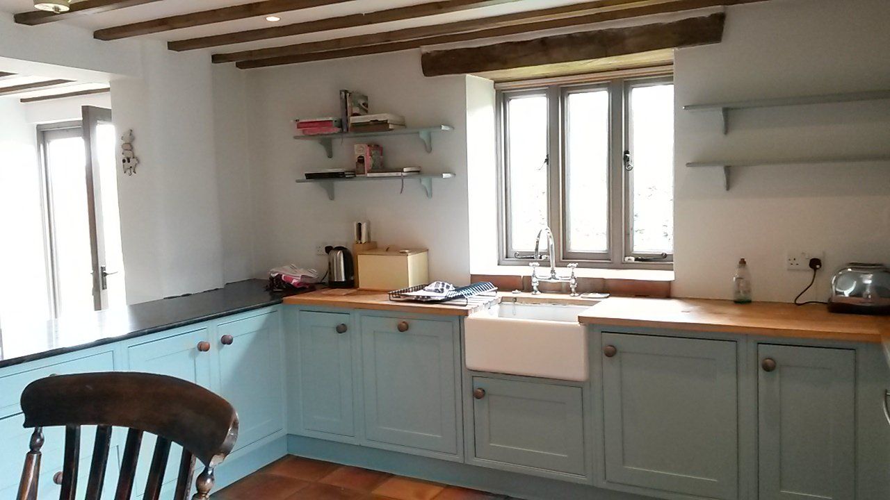 Kitchen units painted in a blue eggshell finish