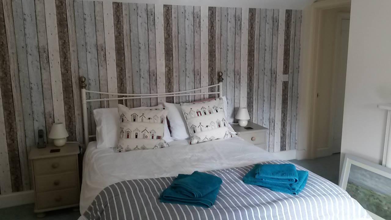 Bedroom feature wall wallpaper wood plank effect