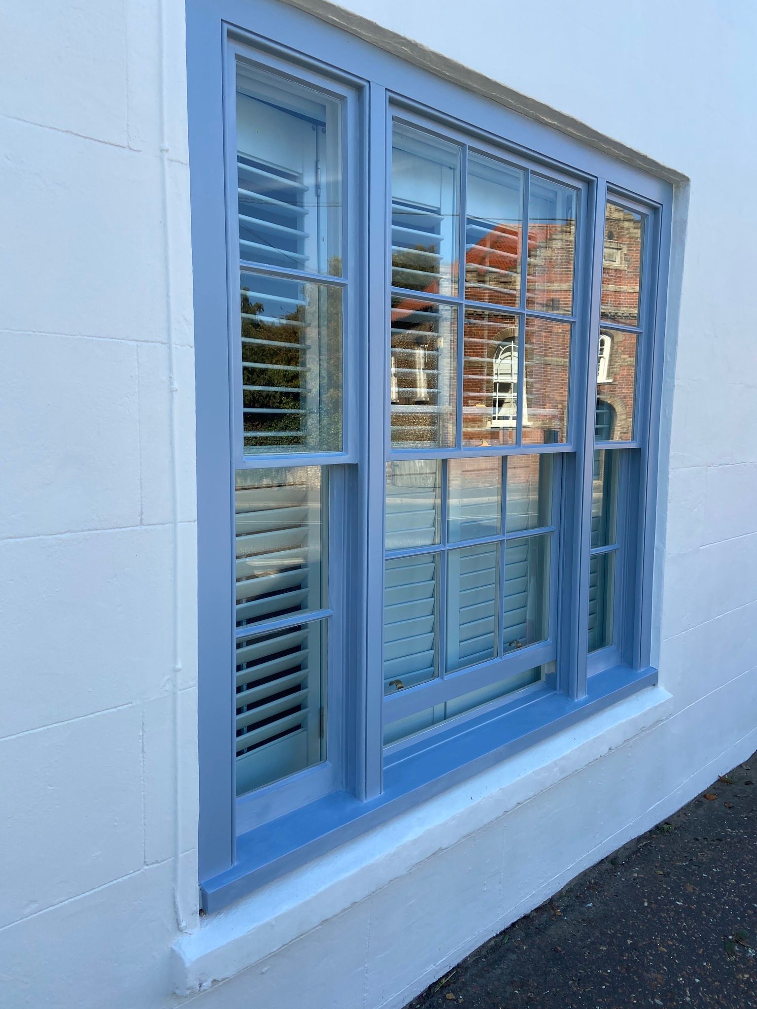 Exterior painting on house in Thornham