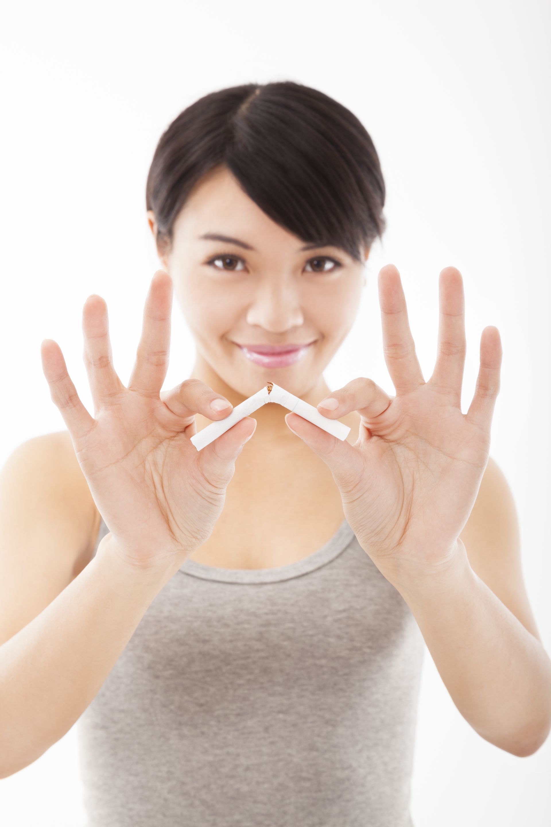 woman breaking cigarette 