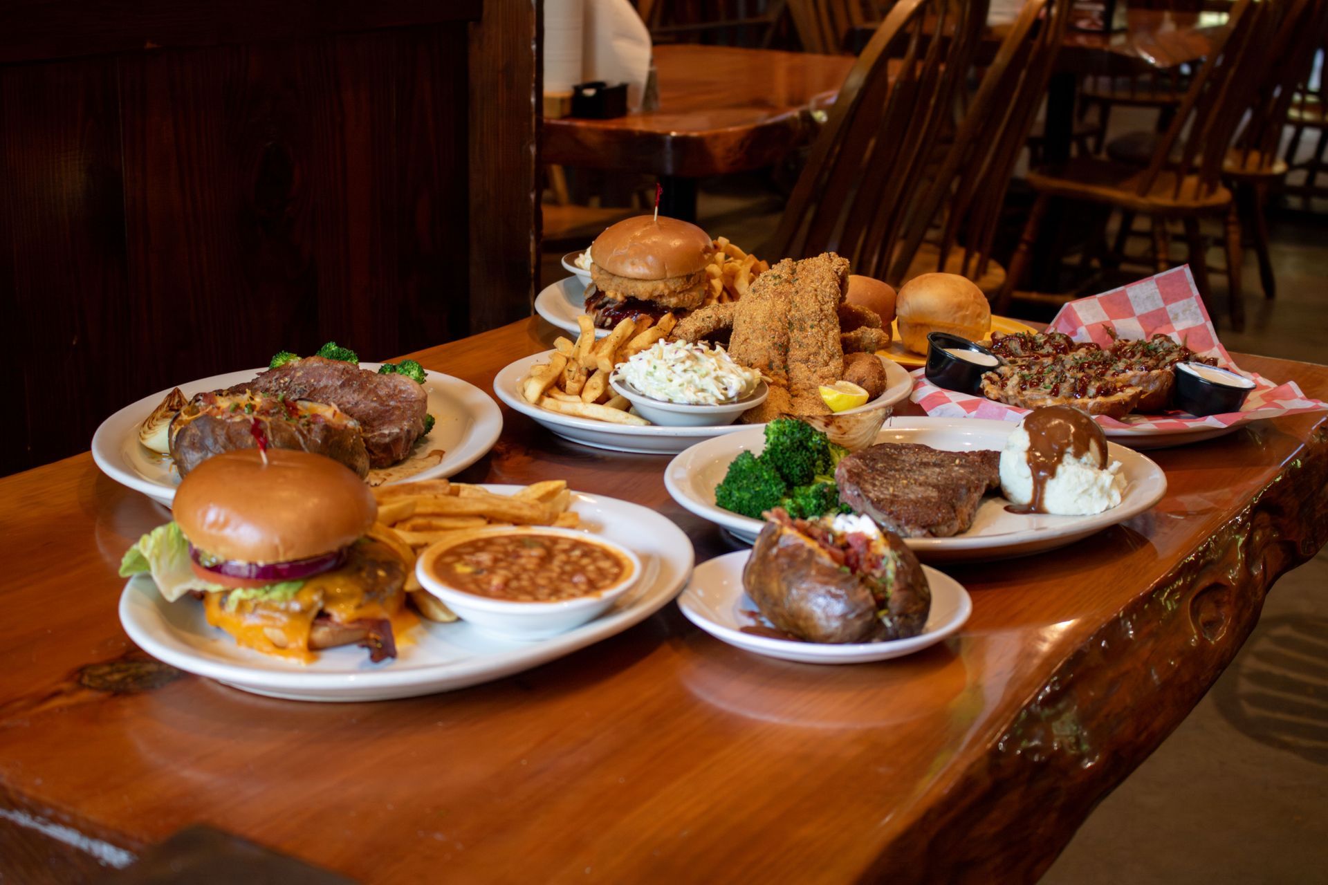 A plate of ribs and a bowl of pulled pork on a table in a restaurant.