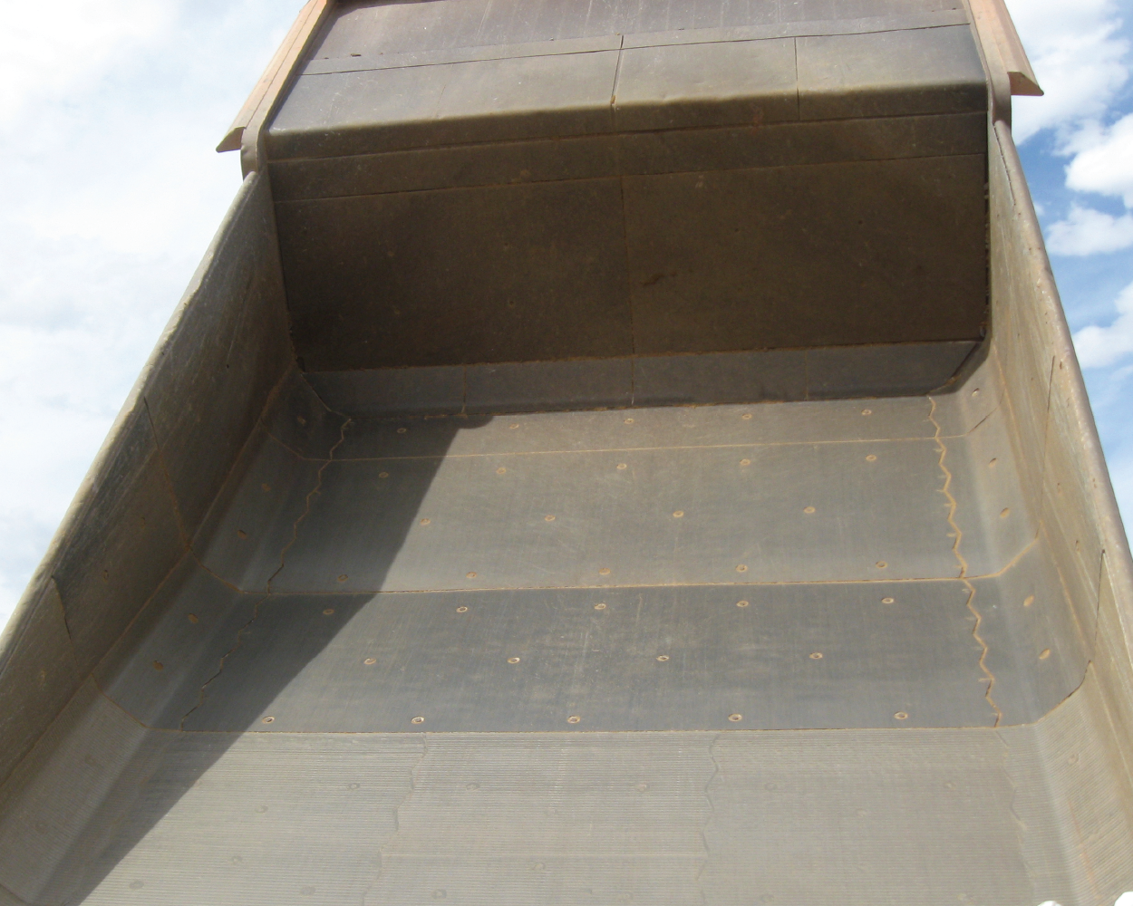 Smooth mining haul truck bed liner package