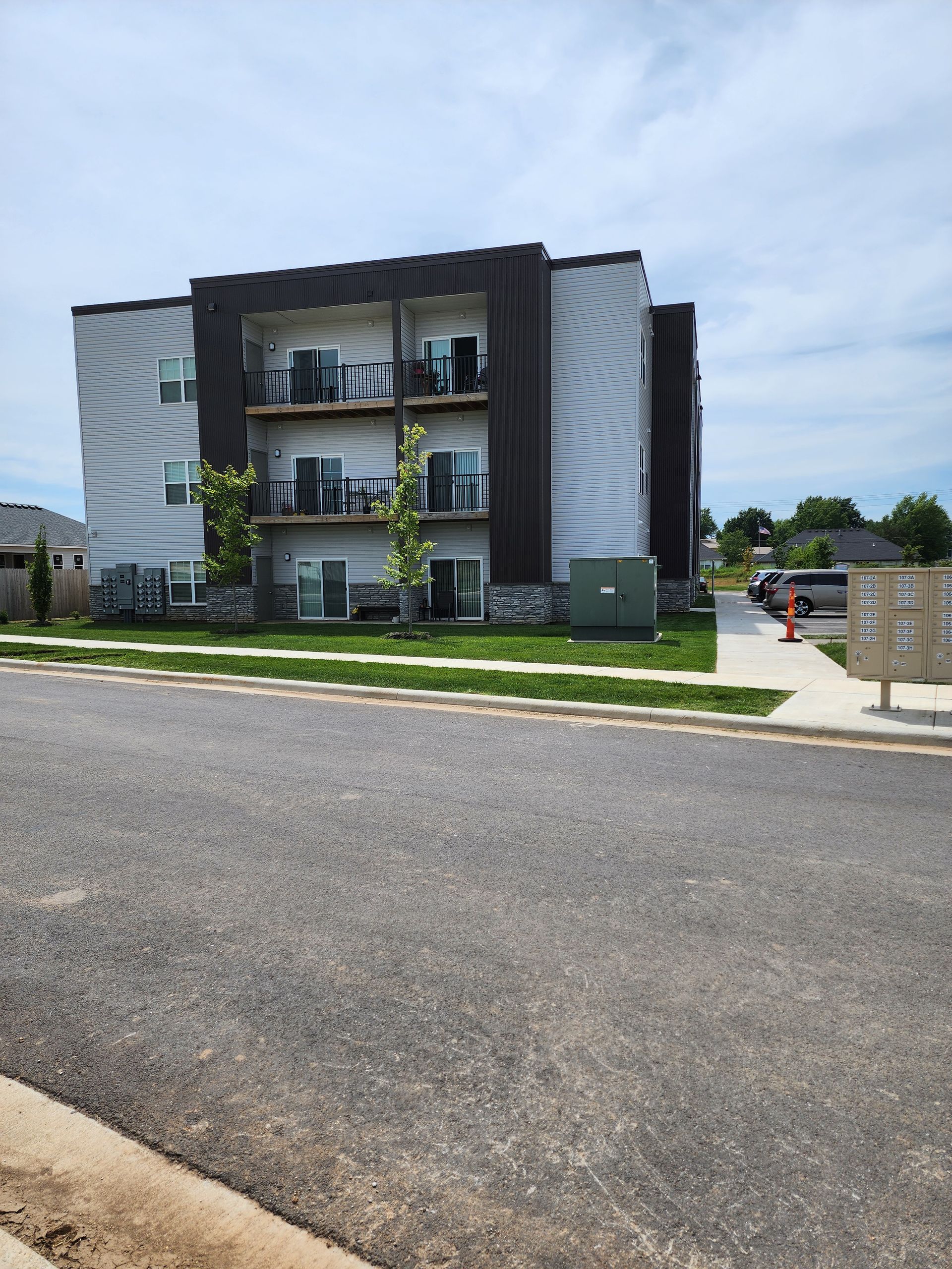 A large apartment building with a lot of windows and balconies