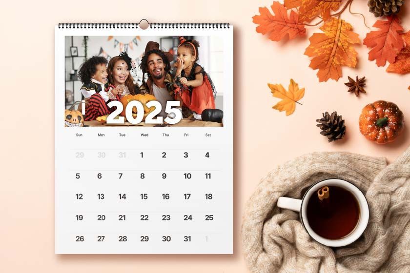 A calendar with flowers on a wooden table