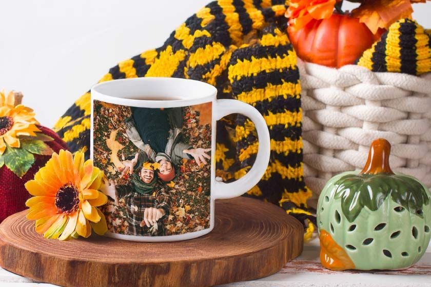 A white coffee mug with a picture of a man and a woman on it