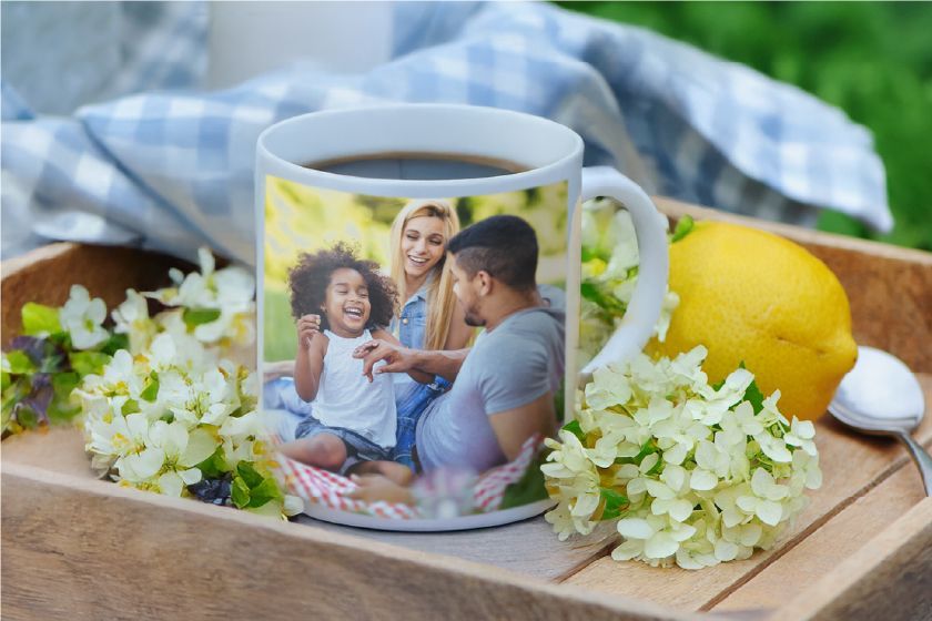 A white coffee mug with a picture of a man and a woman on it