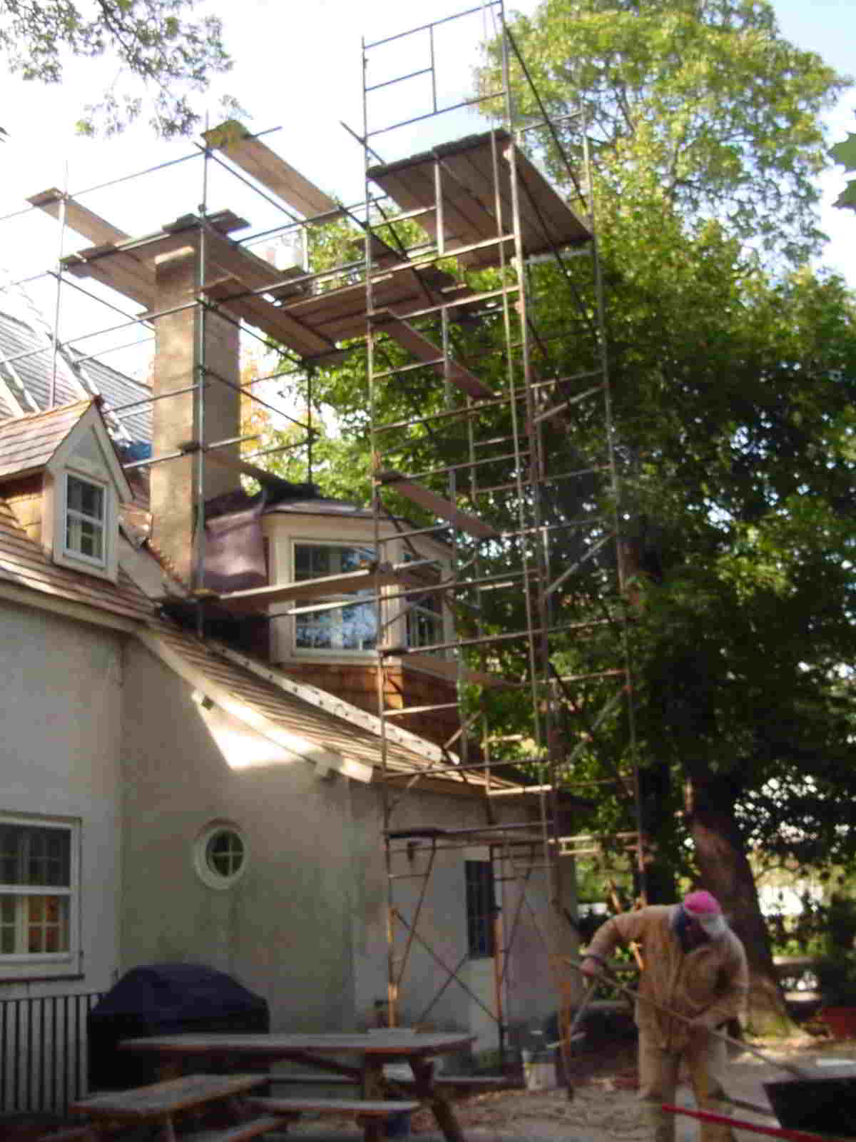 Lake Forest Chimneys — Workers Installing Chimneys On The House in Highland Park, Illinois