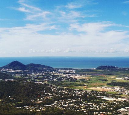 An Aerial View Of A City And Mountains With The Ocean In The Background — Russell Plumbing In Smithfield, QLD