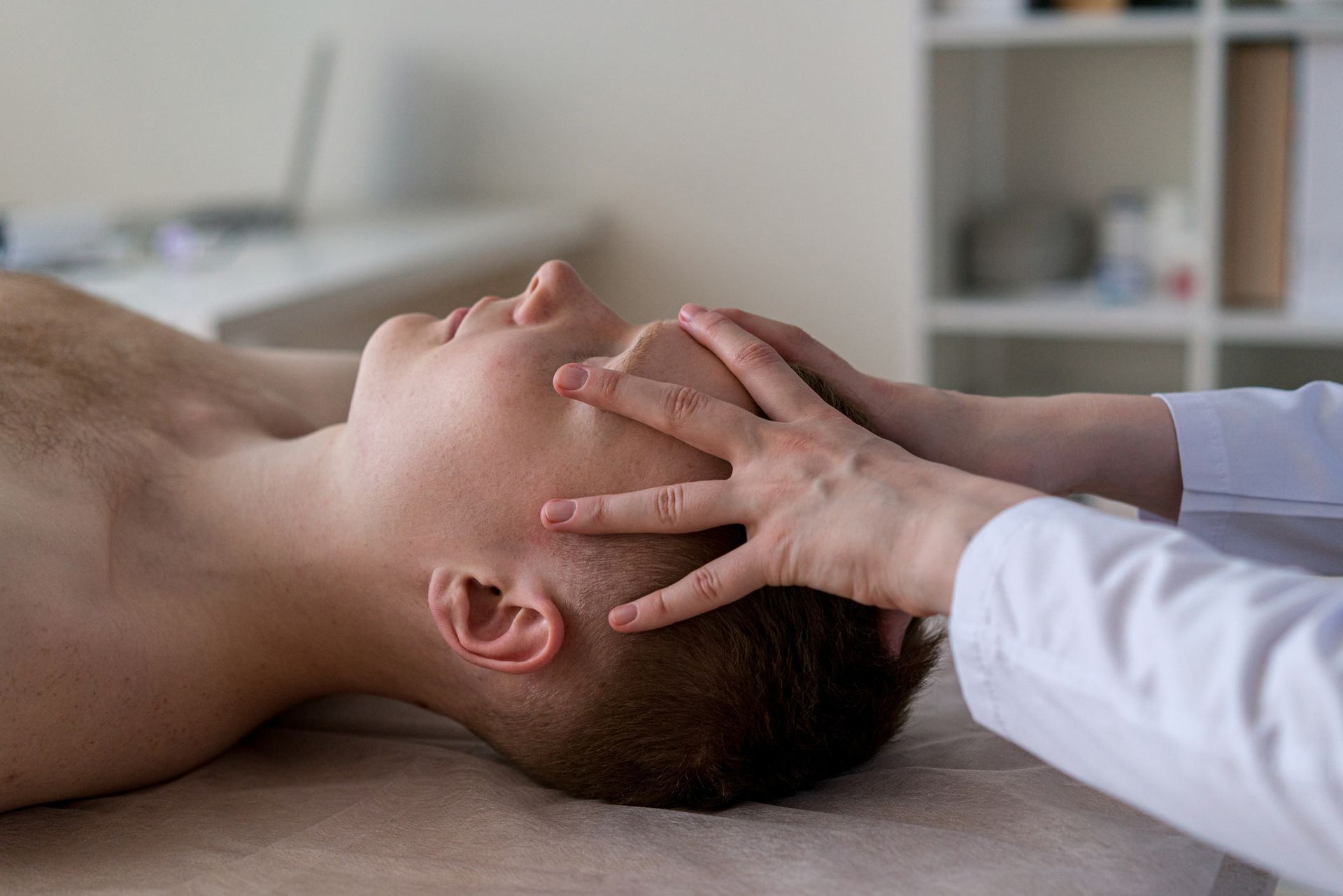 Doctor massaging patient forehead | Echuca, VIC | Echuca Chiropractic Clinic